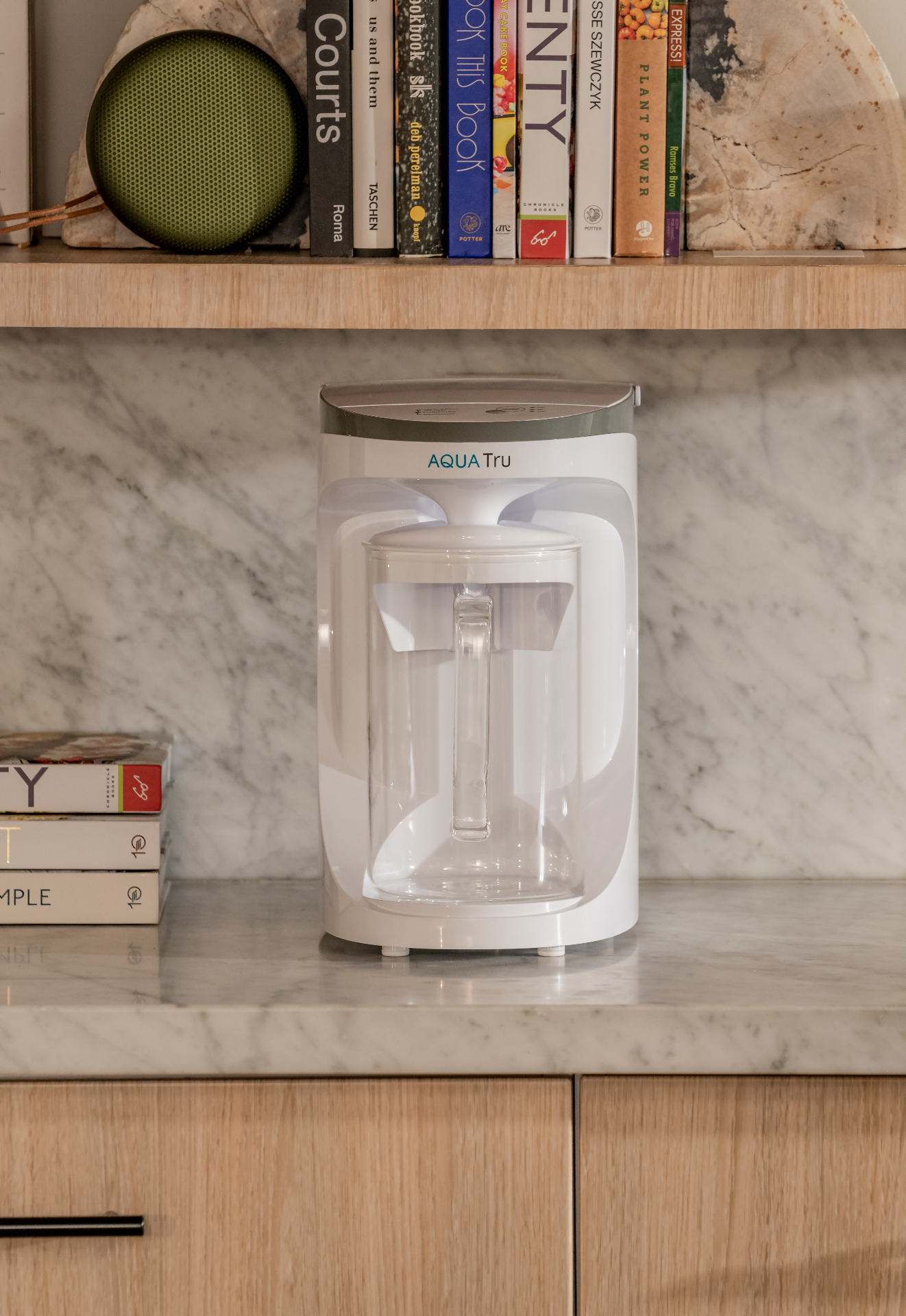 The AquaTru Carafe on a kitchen counter in daily use